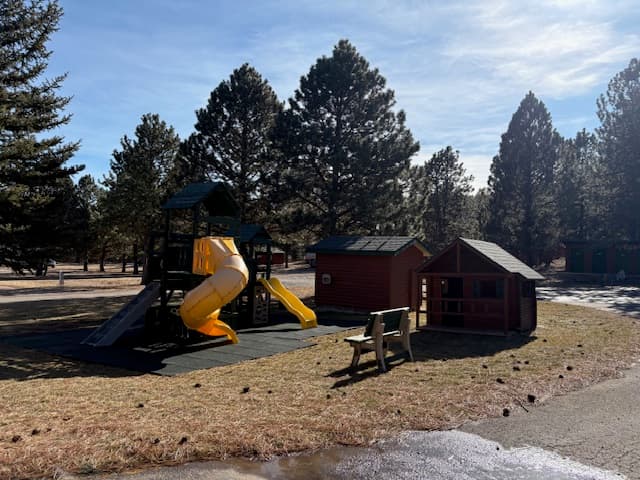 Kids playground slide and play area at Rush No More campground