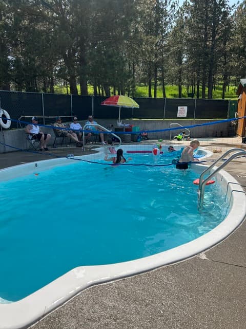 Guests enjoying the heated pool at Rush No More in the Black Hills